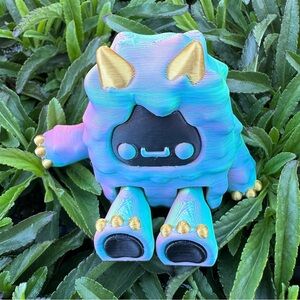 Colorful Yeti Monster Toy with Gold Accents